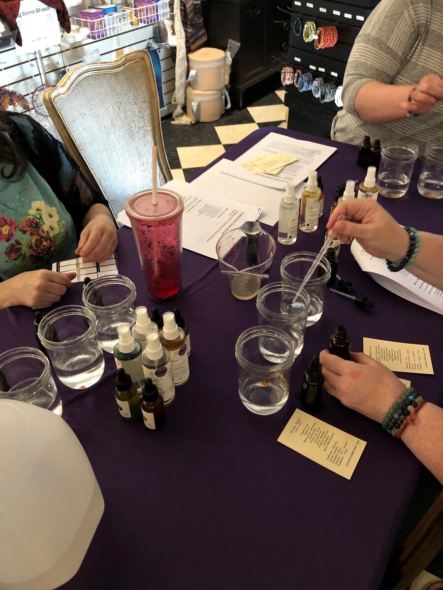 Guests making crystal elixirs at a Prismatic workshop in Michigan