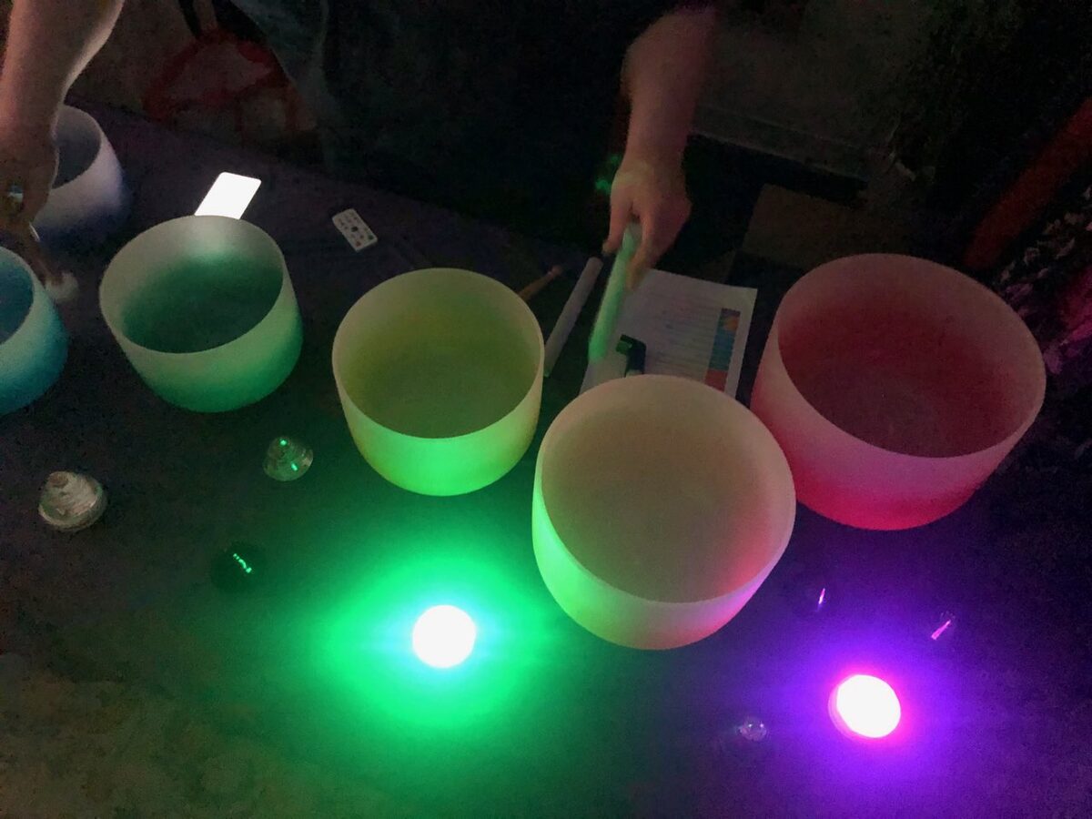 Guests resting during a Prismatic group sound healing session